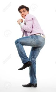 9096879-Scared-man-running-away-with-grimace-in-his-face-wearing-jeans-shirt-and-tie-Stock-Photo